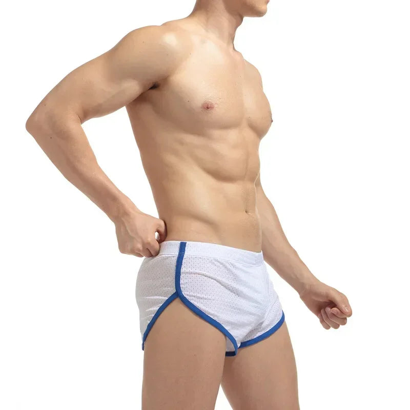 Man wearing white underwear with blue trim on a white background