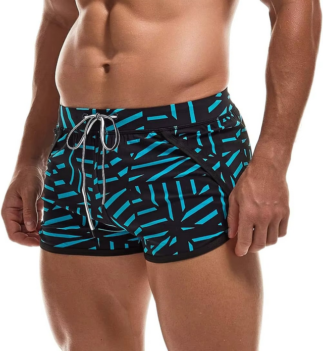 Men's swim trunks with a black and bright turquoise geometric pattern, featuring a white drawstring, shown on a model against a white background.