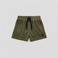 Olive green athletic shorts with a black drawstring and a small black skull logo on the lower left leg, displayed flat against a light gray background.