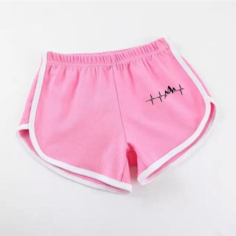 Pink shorts with a black design on a white background